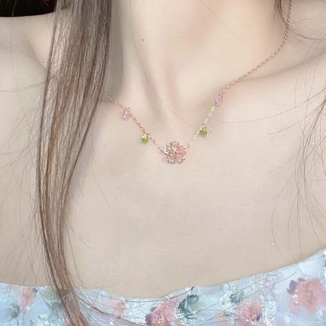 Adorn yourself with the delicate beauty of our blossom necklace. Handcrafted with intricate floral details, it exudes femininity and elegance. Choose from various metals, gemstones,