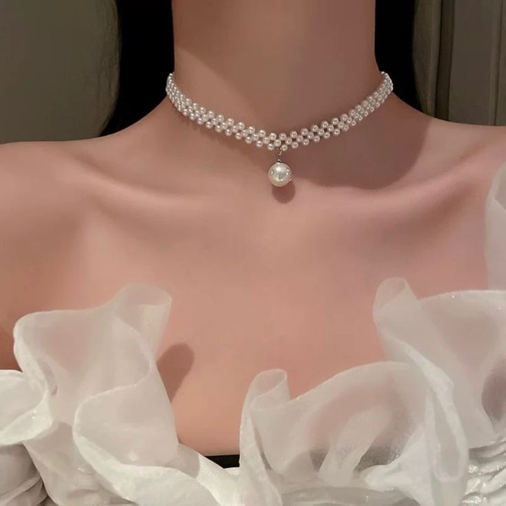 Elevate your elegance with our exquisite white pearl necklace. Strung with lustrous, hand-selected pearls, this classic piece exudes timeless grace and sophistication.