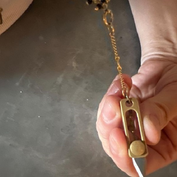 Learn how to wear a men's knife necklace