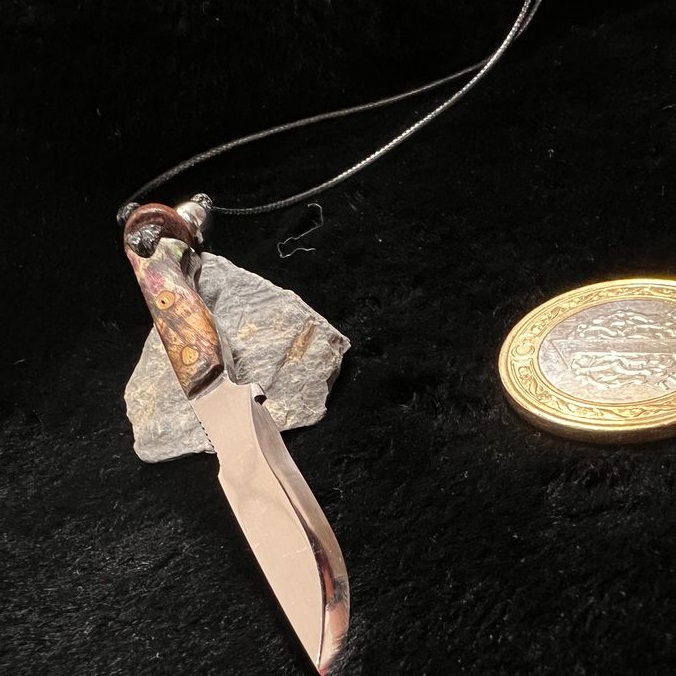 Learn how to wear a men's knife necklace
